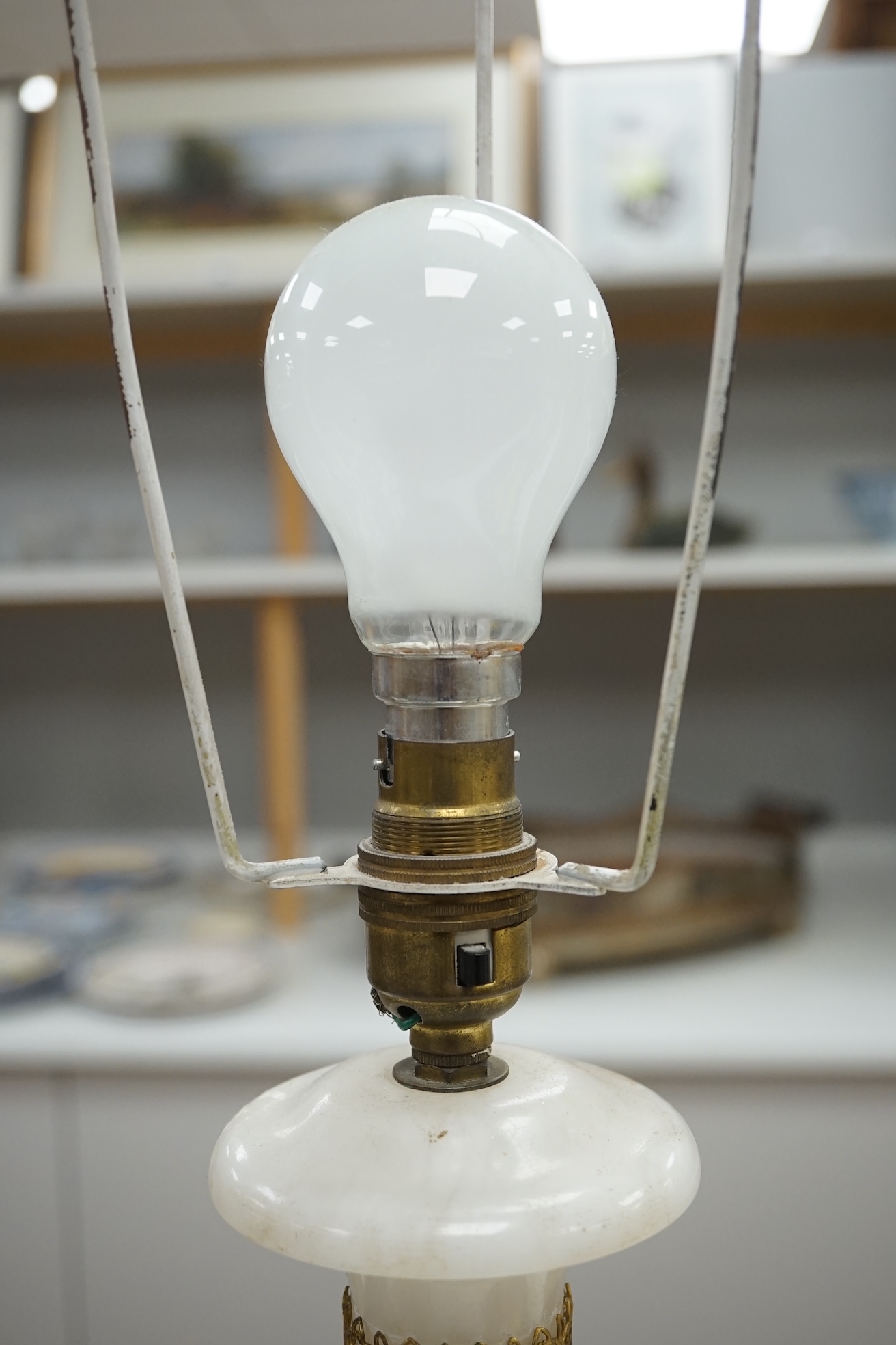 An alabaster and gilt table lamp, 44cm to top of alabaster. Condition - fair